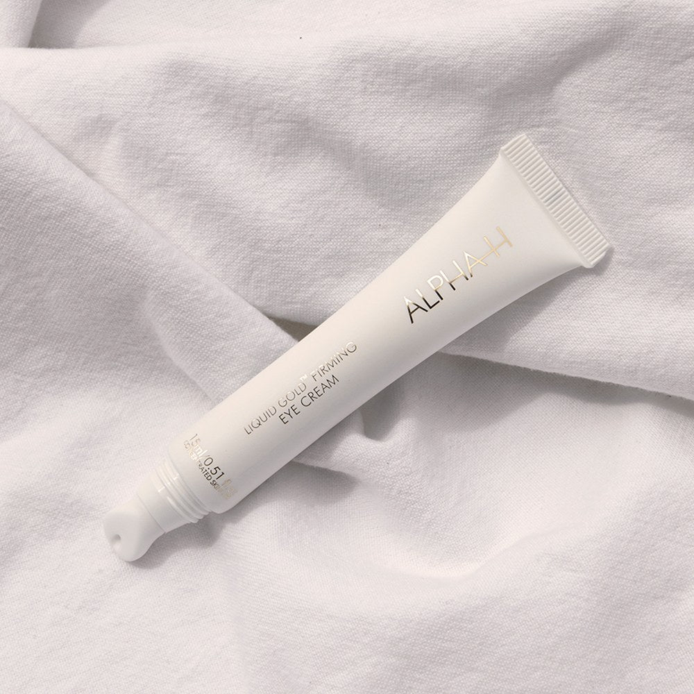 Alpha-H Liquid Gold Firming Eye Cream 15ml tube op doek