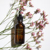 Oolaboo Essential Cocktail Purifying tussen roze bloemetjes