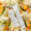 Philip B Magnolia Flowers bodylijn tussen bloemen en sinaasappels